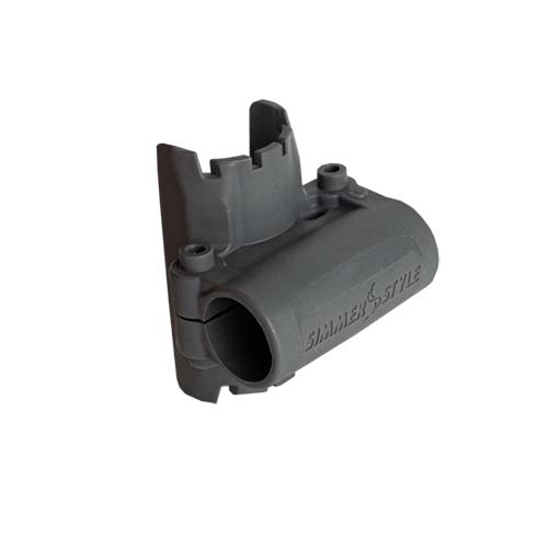 Gray plastic automotive connector housing with a circular socket and mounting tabs/pegs on the sideLoaded with clips for mounting.